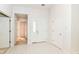 Bright foyer featuring tile flooring, white walls, and a front door with glass detailing at 18009 Sun Ridge Cir, Noblesville, IN 46062