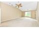 Spacious living room features neutral carpet, ceiling fan, vaulted ceiling, and lots of natural light at 18009 Sun Ridge Cir, Noblesville, IN 46062