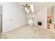 Spacious living room featuring carpet, fireplace, ceiling fan and skylights offering natural light at 18009 Sun Ridge Cir, Noblesville, IN 46062