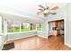Bright sunroom with hardwood flooring, lots of windows, and access to kitchen at 18009 Sun Ridge Cir, Noblesville, IN 46062