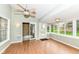 Sunroom with hardwood flooring, a ceiling fan, and lots of natural light at 18009 Sun Ridge Cir, Noblesville, IN 46062