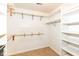 Walk-in closet with built-in shelving and rods for optimal organization and storage space at 18009 Sun Ridge Cir, Noblesville, IN 46062