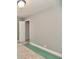 Bedroom with neutral carpet, grey walls, white trim, a door, and an electrical outlet at 1934 N Arlington Ave, Indianapolis, IN 46218