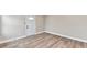 Well-lit entryway features new flooring and a white door with glass panel, offering a clean and inviting space at 1934 N Arlington Ave, Indianapolis, IN 46218