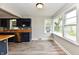 Modern kitchen featuring blue cabinets, butcher block counters, and hardwood floors at 1934 N Arlington Ave, Indianapolis, IN 46218