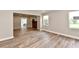 Inviting living space with fresh paint, new floors, and a classic fireplace, perfect for relaxation and entertaining at 1934 N Arlington Ave, Indianapolis, IN 46218