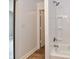 Modern bath and shower featuring sleek fixtures and a white tub surround at 1934 N Arlington Ave, Indianapolis, IN 46218