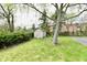 View of a small wooden shed and adjacent landscaped planting bed at 1934 N Arlington Ave, Indianapolis, IN 46218