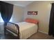 Cozy bedroom with warm lighting and minimalist decor, offering a comfortable retreat at 2012 N Janney Ave, Muncie, IN 47304