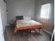 Cozy bedroom featuring hardwood floors and a comfortable bed at 2012 N Janney Ave, Muncie, IN 47304