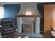 Living room view of a fireplace with decorative accents at 2012 N Janney Ave, Muncie, IN 47304