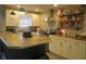 Modern kitchen with bar seating and stainless steel range hood at 2012 N Janney Ave, Muncie, IN 47304