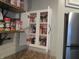 Pantry cabinet in the kitchen with shelves of spices and condiments at 2012 N Janney Ave, Muncie, IN 47304