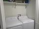 Bright laundry room featuring a washer and dryer, and shelving for storage at 2012 N Janney Ave, Muncie, IN 47304