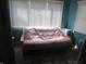 Small sitting room with a couch and window at 2012 N Janney Ave, Muncie, IN 47304
