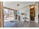 Cozy dining area with light gray flooring, sliding glass doors to a deck, and ample natural light at 220 E Meridian St, Atlanta, IN 46031