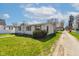 Inviting single-story home with fresh green lawn, classic curb appeal, and a gravel driveway at 220 E Meridian St, Atlanta, IN 46031