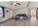 Bright living room featuring light gray flooring, a ceiling fan, and a comfortable, inviting atmosphere at 220 E Meridian St, Atlanta, IN 46031