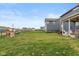 Large backyard with black metal fence and play house at 2208 Dudley Ave, Westfield, IN 46074