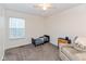 Cozy bedroom with a toddler bed, plush armchair, and natural light from a large window at 2208 Dudley Ave, Westfield, IN 46074
