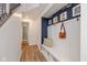 Hallway with a built-in bench, coat hooks, and decor for an organized and welcoming entry at 2208 Dudley Ave, Westfield, IN 46074