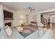 Comfortable living room featuring a fireplace, plush sofa, and open floor plan at 2208 Dudley Ave, Westfield, IN 46074