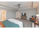 Large main bedroom with tray ceiling, natural light, and connected ensuite bathroom and closet at 2208 Dudley Ave, Westfield, IN 46074