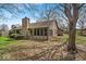 Home backyard with a screened-in porch and patio space at 2214 Van Ness Pl, Indianapolis, IN 46240