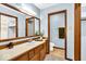 Well-lit bathroom with wooden vanity and ample counter space at 2214 Van Ness Pl, Indianapolis, IN 46240