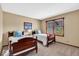 Comfortable bedroom featuring twin beds, natural light, and neutral decor at 2214 Van Ness Pl, Indianapolis, IN 46240