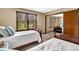 Comfortable bedroom with two twin beds, carpeted floor, and natural light from window at 2214 Van Ness Pl, Indianapolis, IN 46240