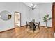 Inviting dining space showcasing a round table and a large window with wooded views at 2214 Van Ness Pl, Indianapolis, IN 46240