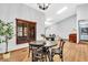 A dining area with ample natural light, hardwood floors, and views of the surrounding landscape at 2214 Van Ness Pl, Indianapolis, IN 46240