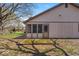 Home exterior with screened-in porch and patio space with unique brick at 2214 Van Ness Pl, Indianapolis, IN 46240
