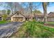Charming single-story home with attached garage and well-manicured lawn in a peaceful neighborhood at 2214 Van Ness Pl, Indianapolis, IN 46240