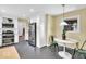 Bright kitchen with stainless steel appliances, white cabinetry, and an adjacent breakfast nook at 2214 Van Ness Pl, Indianapolis, IN 46240