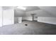 Spacious carpeted attic room with white walls, door, and built in unit at 2226 N Capitol Ave, Indianapolis, IN 46208