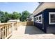 Exterior wooden deck, blue siding, white trim, and green foliage at 2226 N Capitol Ave, Indianapolis, IN 46208