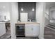 Stylish bar area with a built-in wine fridge, wood countertop, and decorative pendant lighting at 2226 N Capitol Ave, Indianapolis, IN 46208