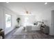 Bright bedroom features wood floors, a ceiling fan, and large windows for ample natural light at 2226 N Capitol Ave, Indianapolis, IN 46208