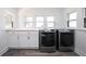 Functional laundry room with modern machines, storage cabinets, and natural light at 2226 N Capitol Ave, Indianapolis, IN 46208