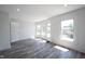 Bright, spacious room with updated floors, large windows, and modern trim at 2226 N Capitol Ave, Indianapolis, IN 46208
