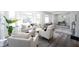 Open-concept living room with modern furniture, wood floors, and plenty of natural light at 2226 N Capitol Ave, Indianapolis, IN 46208
