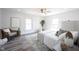 Serene main bedroom with neutral tones, a ceiling fan, and plenty of natural light at 2226 N Capitol Ave, Indianapolis, IN 46208