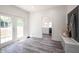 Bright mudroom with access to the backyard and a convenient bench with storage at 2226 N Capitol Ave, Indianapolis, IN 46208