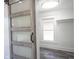 Well-lit walk-in closet featuring a unique sliding barn door at 2226 N Capitol Ave, Indianapolis, IN 46208