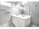 Modern bathroom with a double vanity, white cabinets, and large mirrors, offering a clean and stylish design at 2316 N Pennsylvania St # 1, Indianapolis, IN 46205
