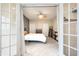 Inviting bedroom with French doors, a ceiling fan, and ample natural light, offering a relaxing retreat at 2316 N Pennsylvania St # 1, Indianapolis, IN 46205