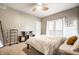 Serene bedroom with French doors, a ceiling fan, and cozy furnishings, creating a peaceful and inviting space at 2316 N Pennsylvania St # 1, Indianapolis, IN 46205