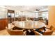 Bright dining area with a wooden table, chairs, and stainless steel refrigerator, ideal for Gathering gatherings at 2316 N Pennsylvania St # 1, Indianapolis, IN 46205